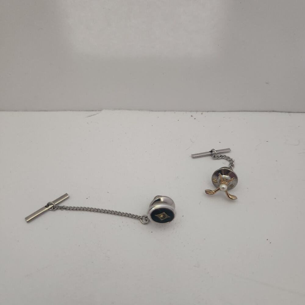 2 vintage  tie tacks. Golf and onyx